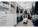 Spacious walk-in closet with custom shelving, drawers, and ample hanging space for organized storage at 1265 E La Fortuna Ct, San Tan Valley, AZ 85140