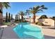 Refreshing pool with a cool deck and multiple large palm trees and manicured shrubs at 12712 W Wilshire Dr, Avondale, AZ 85392