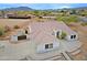 A high angle of the house featuring a well maintained exterior and outdoor horse facilities at 130 E Jordon Ln, Phoenix, AZ 85086
