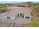 Aerial view of a home with a Spanish tile roof and gravel landscaping at 130 E Jordon Ln, Phoenix, AZ 85086