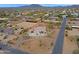 A desert property with a home featuring multi-car garage, an arena, and bordered by mountains at 130 E Jordon Ln, Phoenix, AZ 85086