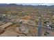 A neighborhood property with a home featuring a multi-car garage, bordered by mountains, and an arena at 130 E Jordon Ln, Phoenix, AZ 85086