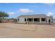 Expansive backyard featuring desert landscaping and a covered patio, perfect for outdoor relaxation at 130 E Jordon Ln, Phoenix, AZ 85086