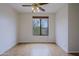 Bedroom featuring plank floors, ceiling fan, and a window providing outdoor views at 130 E Jordon Ln, Phoenix, AZ 85086
