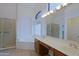 Elegant bathroom featuring a large soaking tub, separate shower, and dual sinks with a vanity area at 130 E Jordon Ln, Phoenix, AZ 85086