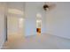 Large main bedroom with carpet, ceiling fan and adjoining bathroom at 130 E Jordon Ln, Phoenix, AZ 85086