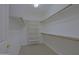 Bright walk-in closet with shelving and racks at 130 E Jordon Ln, Phoenix, AZ 85086