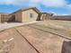 Spacious backyard with a covered patio and plenty of room for outdoor activities at 13202 N 126Th Ave, El Mirage, AZ 85335