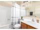 Bathroom featuring tub, shower, decorative mirror, and vanity with updated lighting at 1417 N Brittany Ln, Gilbert, AZ 85233