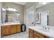 This large full bathroom features double sinks, white countertops and tile floors at 1554 E Stirrup Ct, Gilbert, AZ 85296