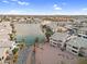 Aerial view of waterfront condos with a lake view and a fountain feature at 16013 S Desert Foothills Pkwy # 2089, Phoenix, AZ 85048