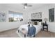 Bright bedroom with a large window offering scenic neighborhood views at 16013 S Desert Foothills Pkwy # 2089, Phoenix, AZ 85048