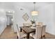 Cozy dining area featuring a stylish chandelier and seating for six at 16013 S Desert Foothills Pkwy # 2089, Phoenix, AZ 85048