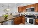 Kitchen island with granite countertops and stainless steel appliances at 16013 S Desert Foothills Pkwy # 2089, Phoenix, AZ 85048