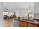 View of the kitchen leading into the living room and dining area at 16013 S Desert Foothills Pkwy # 2089, Phoenix, AZ 85048