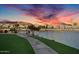 Beautiful lake view highlighting the community and its serene waterfront location at sunset at 16013 S Desert Foothills Pkwy # 2089, Phoenix, AZ 85048