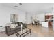 Open concept living room leading into a dining area and kitchen at 16013 S Desert Foothills Pkwy # 2089, Phoenix, AZ 85048