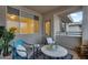 Relaxing covered patio featuring cozy seating, stylish decor, and plenty of natural light at 16013 S Desert Foothills Pkwy # 2089, Phoenix, AZ 85048