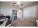 A well-lit room with neutral walls and carpet features a closet and bookcase at 16071 W Sand Hills Rd, Surprise, AZ 85387