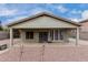 A covered patio and gravel landscaping highlight this backyard at 1635 W Dunbar Dr, Phoenix, AZ 85041