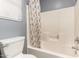 Bright bathroom featuring a toilet, a shower and curtain at 1635 W Dunbar Dr, Phoenix, AZ 85041