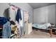 Brightly decorated room with blue painted walls, featuring a small bed and colorful curtains at 1635 W Dunbar Dr, Phoenix, AZ 85041