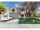 Two-story home with a two-car garage, neutral paint scheme, lawn, and mature trees at 1635 W Dunbar Dr, Phoenix, AZ 85041