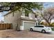 Two-story home with a two-car garage, neutral paint scheme, lawn, and mature trees at 1635 W Dunbar Dr, Phoenix, AZ 85041
