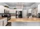 Well-lit kitchen featuring modern appliances, light countertops, and pendant lighting at 1635 W Dunbar Dr, Phoenix, AZ 85041