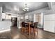 Kitchen and dining area with matching chairs and laminate floors at 1635 W Dunbar Dr, Phoenix, AZ 85041
