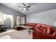 Spacious living room features a vaulted ceiling, large windows, and comfortable seating at 1635 W Dunbar Dr, Phoenix, AZ 85041