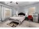 Calm main bedroom with a dark headboard, bedside tables, and natural light at 1635 W Dunbar Dr, Phoenix, AZ 85041