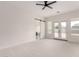 Large, carpeted primary bedroom with modern ensuite bathroom and access to the backyard patio at 1645 E Minton St, Mesa, AZ 85203
