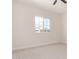Bright bedroom featuring a ceiling fan and neutral carpet at 1645 E Minton St, Mesa, AZ 85203