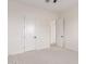 Bedroom showcasing modern doors and neutral carpet at 1645 E Minton St, Mesa, AZ 85203