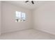 Bright bedroom featuring a ceiling fan and neutral carpet at 1645 E Minton St, Mesa, AZ 85203