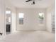 Bright bedroom featuring neutral carpet, recessed lighting and a ceiling fan at 1645 E Minton St, Mesa, AZ 85203