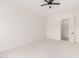 Bright bedroom features neutral carpet and ceiling fan for a modern, clean aesthetic at 1645 E Minton St, Mesa, AZ 85203