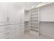 Well-organized closet with white cabinets and shelves provides ample storage space at 1645 E Minton St, Mesa, AZ 85203