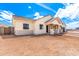 Low angle view of a stucco home with desert landscaping, a covered entry, stone accents, and a tile roof at 1645 E Minton St, Mesa, AZ 85203