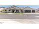 Charming single-story home with white exterior, stone accents, and a three-car garage at 1645 E Minton St, Mesa, AZ 85203