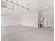 Spacious garage with high ceilings, ample storage, and clean epoxy flooring at 1645 E Minton St, Mesa, AZ 85203