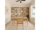 Bright home office features a built-in bookcase, modern desk, and natural light from the window at 1645 E Minton St, Mesa, AZ 85203