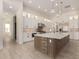 Stunning kitchen features a large island, stainless appliances, and white cabinetry with modern hardware at 1645 E Minton St, Mesa, AZ 85203