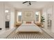Bright main bedroom with ensuite, walk-in closet, and minimalist decor with wood accents at 1645 E Minton St, Mesa, AZ 85203