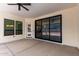 Covered patio with a ceiling fan and sliding glass doors at 1645 E Minton St, Mesa, AZ 85203
