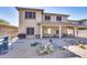 Beautiful backyard featuring desert landscaping, brick pavers, covered patio, and a built-in BBQ at 16532 W Rowel Rd, Surprise, AZ 85387