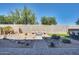 Spacious backyard with built-in grill, rock garden, desert landscaping, and desert landscaping at 16532 W Rowel Rd, Surprise, AZ 85387