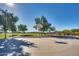 The community outdoor basketball court is great for exercise and recreation on a clear, sunny day at 16532 W Rowel Rd, Surprise, AZ 85387