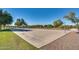 Community outdoor basketball court with greenery around the play area at 16532 W Rowel Rd, Surprise, AZ 85387
